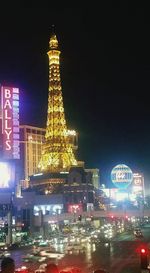 Illuminated city street at night