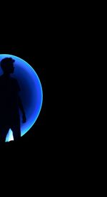 Silhouette people against black background