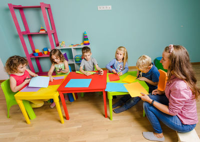 Teacher with students sitting in classroom