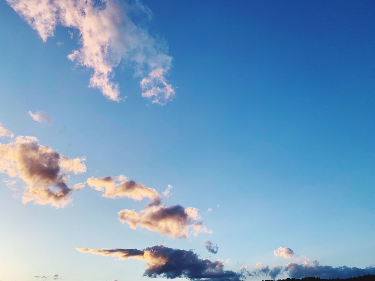 sky, beauty in nature, cloud - sky, low angle view, tranquility, scenics - nature, tranquil scene, no people, blue, nature, day, outdoors, idyllic, backgrounds, copy space, sunlight, non-urban scene, white color, full frame, sunset, meteorology