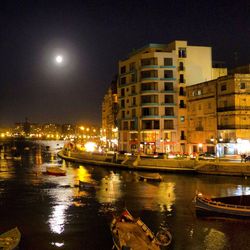 Buildings in city at night