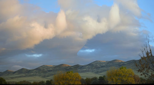 Panoramic view of mountains against sky during sunset