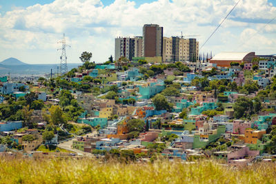 Buildings in city against sky