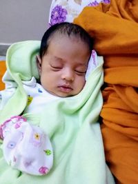 Cute baby sleeping on bed