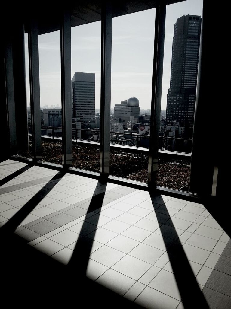 architecture, built structure, building exterior, city, indoors, modern, glass - material, office building, window, skyscraper, building, sunlight, shadow, reflection, tall - high, day, sky, tower, transparent, cityscape