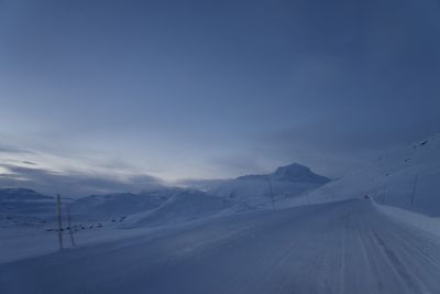 Scenic view of snow covered mountain against sky