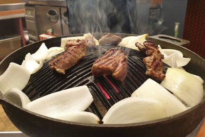 Close-up of meat on barbecue grill