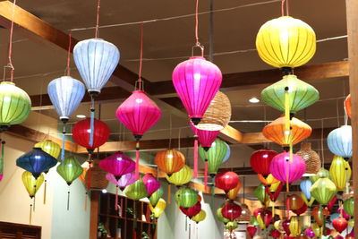 Low angle view of lanterns hanging on ceiling