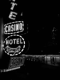 Information sign in city at night