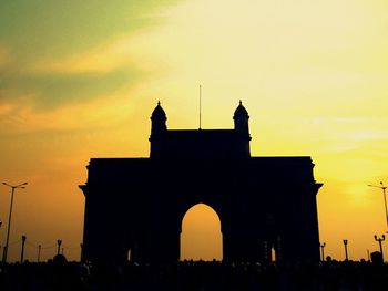 Silhouette of building during sunset