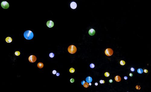 Low angle view of defocused lights