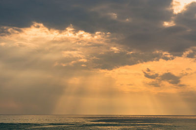 Scenic view of sea against dramatic sky