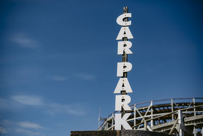 Low angle view of communications tower against sky