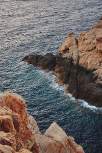 High angle view of rocks on shore