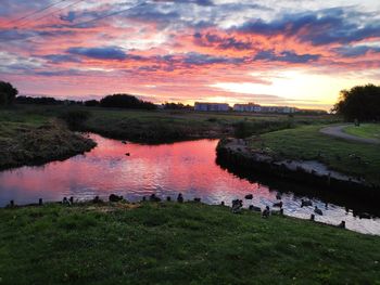Scenic view of lake against sky during sunset