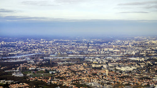 High angle view of illuminated cityscape against sky