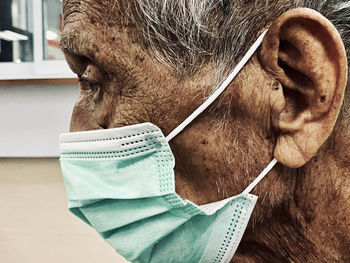 Close-up portrait of man wearing mask