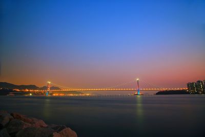 View of suspension bridge at night