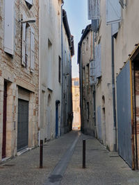 Narrow alley amidst buildings in city