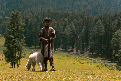 Rear view of man standing on field