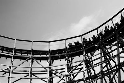 Low angle view of ferris wheel against sky