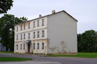 Street by building against sky