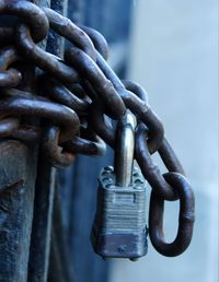 Close-up of metallic chain with padlock