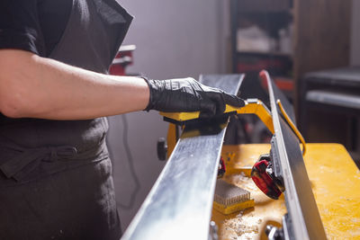 Midsection of man working at dusk