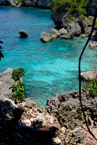 High angle view of rocks by sea