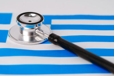 High angle view of blue container on table