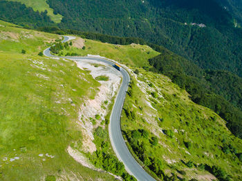 High angle view of road amidst mountains