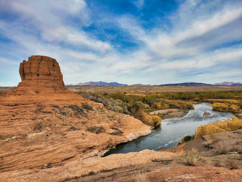 Rock formations on landscape against sky