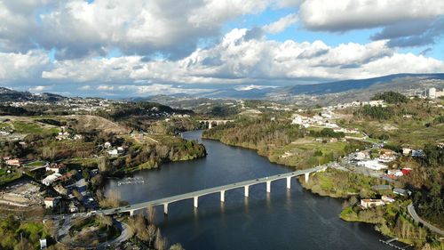 High angle view of river amidst trees against sky