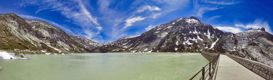 Panoramic shot of snowcapped mountains against sky