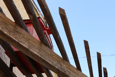 Low angle view of built structure against clear blue sky