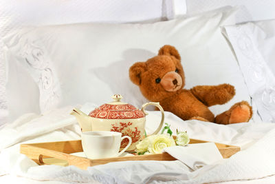 High angle view of teddy bear on bed at home