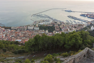 Panoramic view of salerno waterfront with new under construction buildings. the view arechi castel