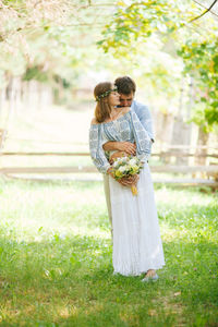 Couple standing on grass