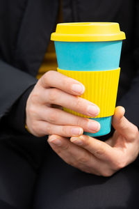 Midsection of woman holding ice cream