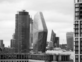 Modern buildings in city against sky