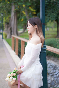 Young woman holding bouquet