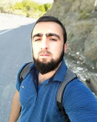 Portrait of young man standing outdoors