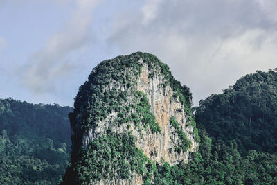 Close-up of rock against sky