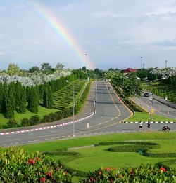 Scenic view of rainbow over landscape against sky