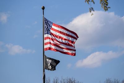 Low angle view of flag against sky