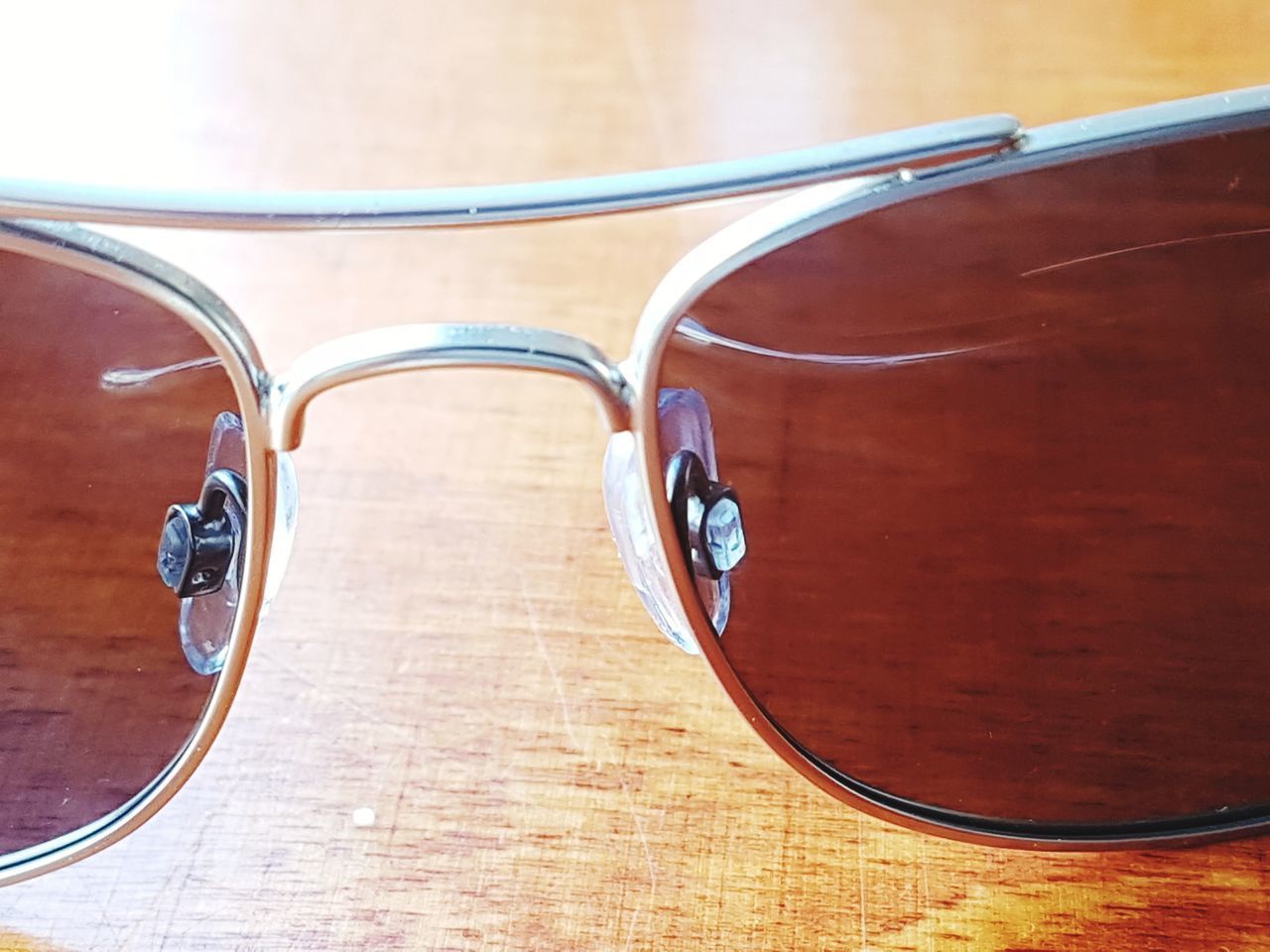 HIGH ANGLE VIEW OF SUNGLASSES ON TABLE AT HOME
