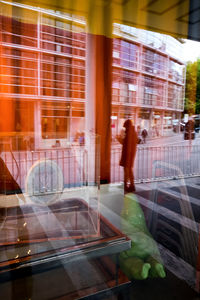 Reflection of man on window