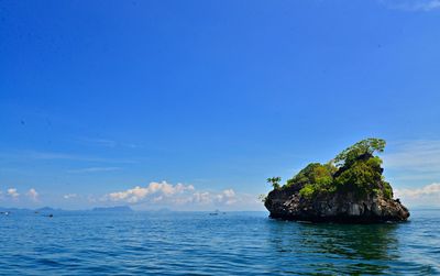 Scenic view of sea against blue sky