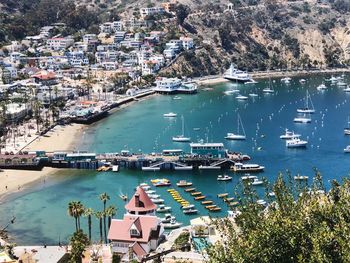 High angle view of harbor and buildings in city