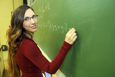 Portrait of young woman studying 